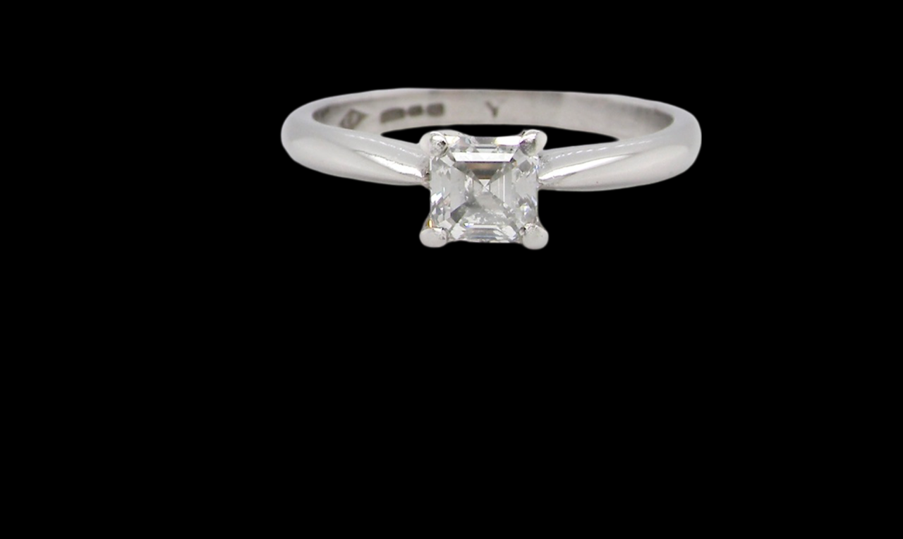 An emerald cut platinum solitaire Diamond Ring