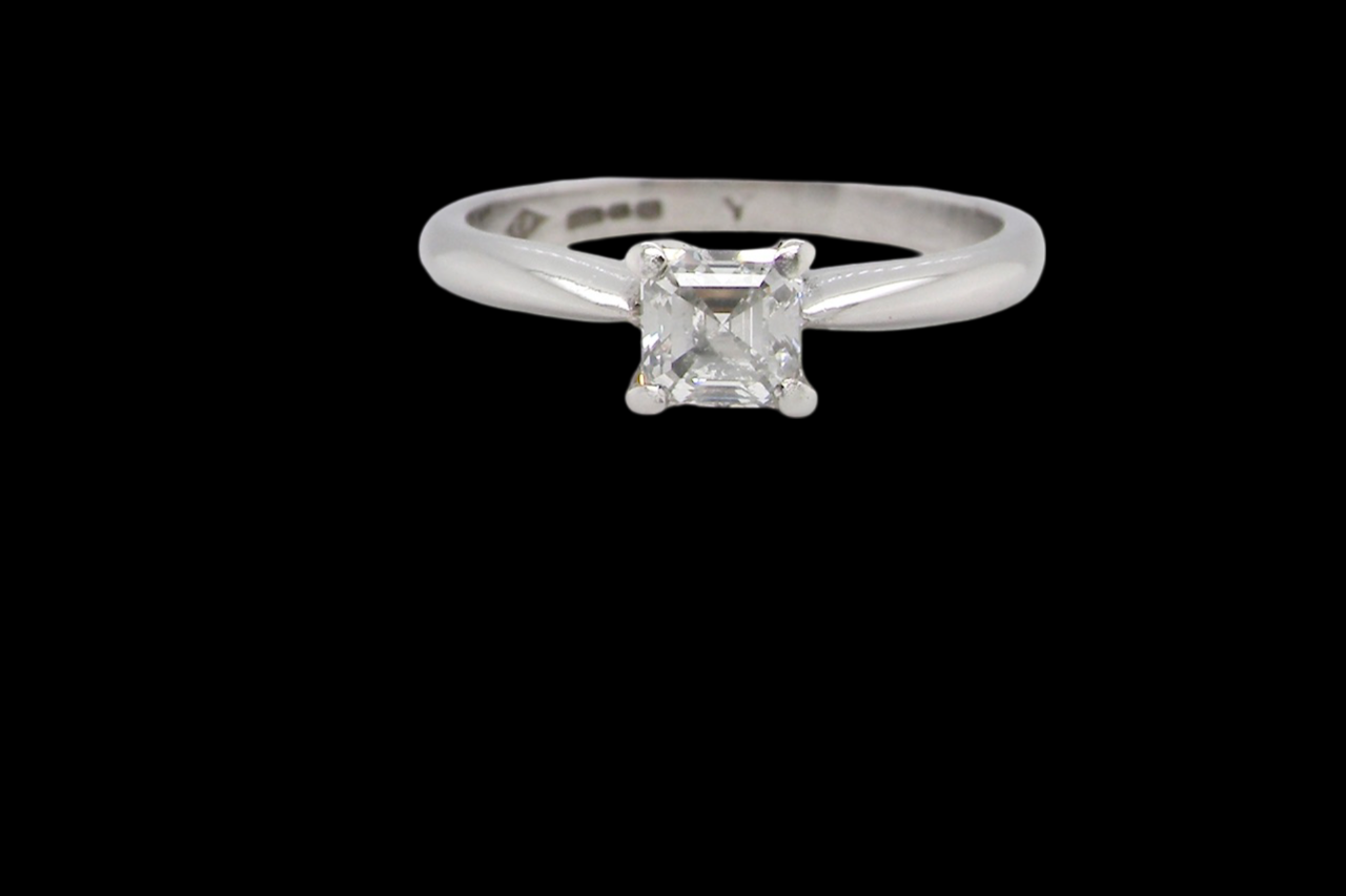An emerald cut platinum solitaire Diamond Ring
