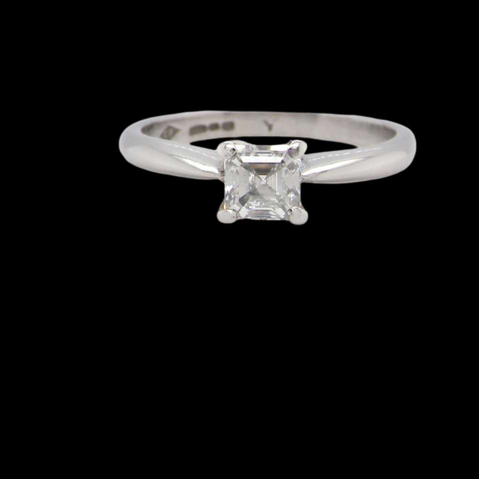 An emerald cut platinum solitaire Diamond Ring