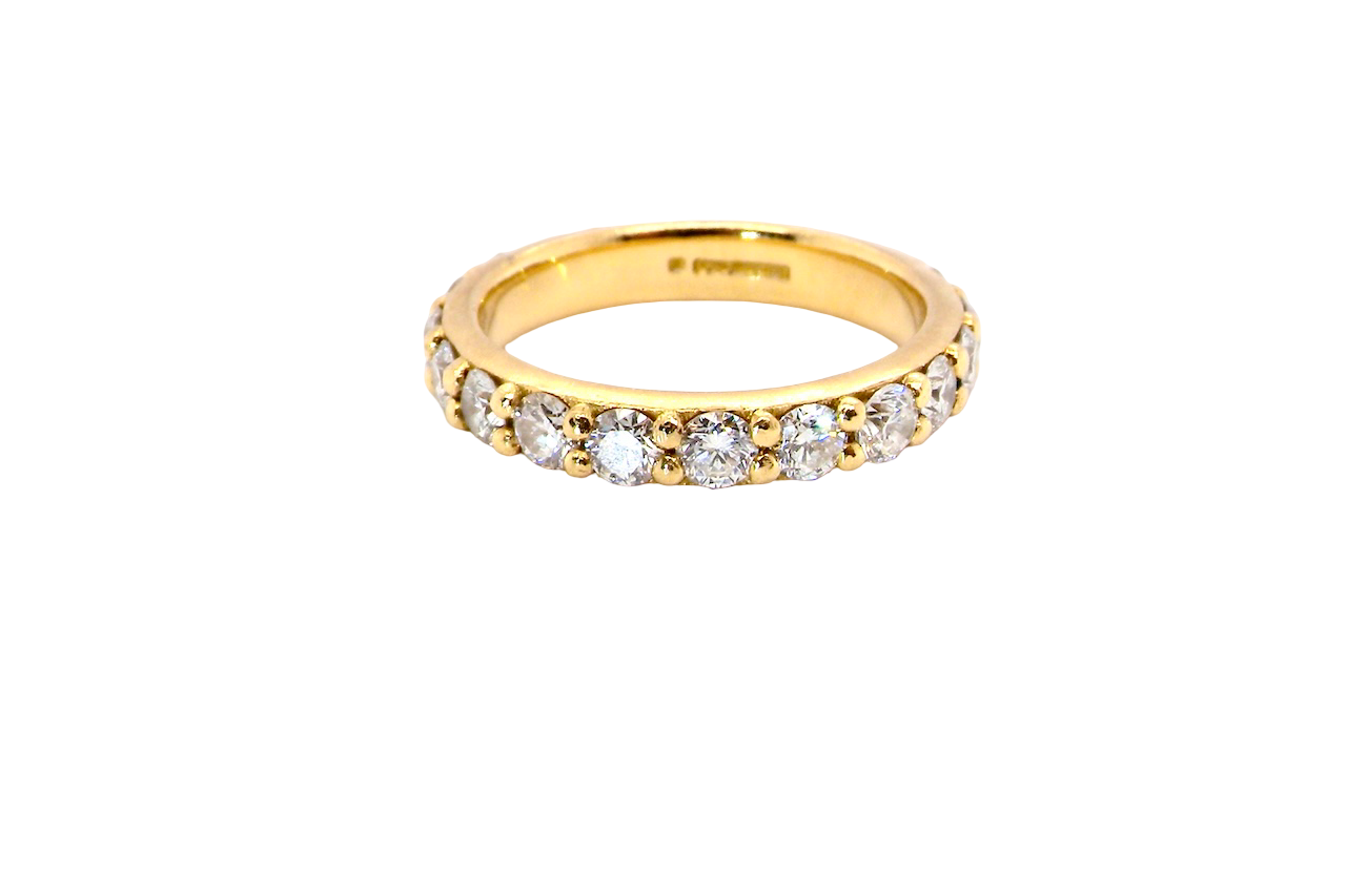 eternity ring is crafted in 18ct gold and set with fourteen round brilliant-cut white diamonds.