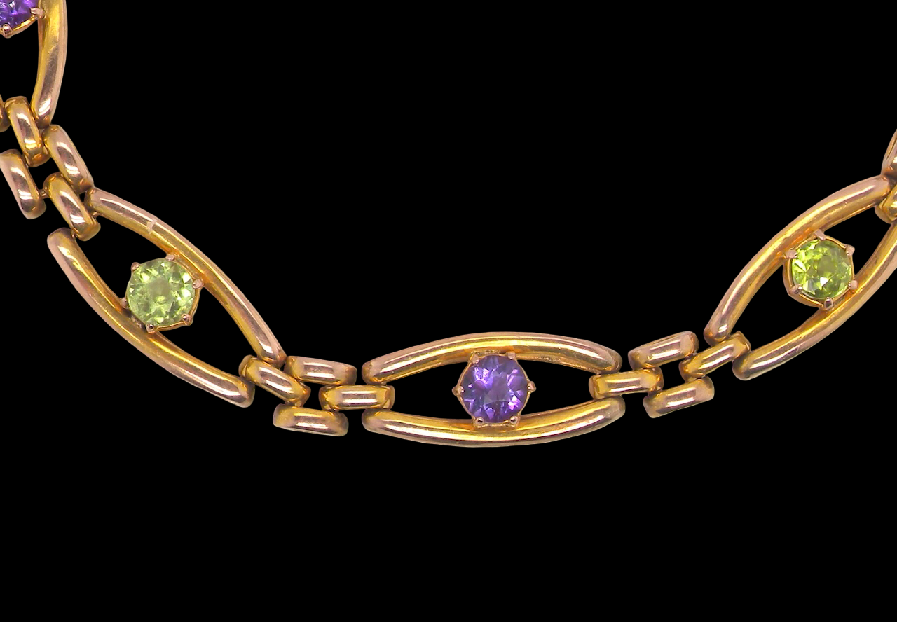 exquisite early 20th century bracelet set with peridot and amethyst stones,