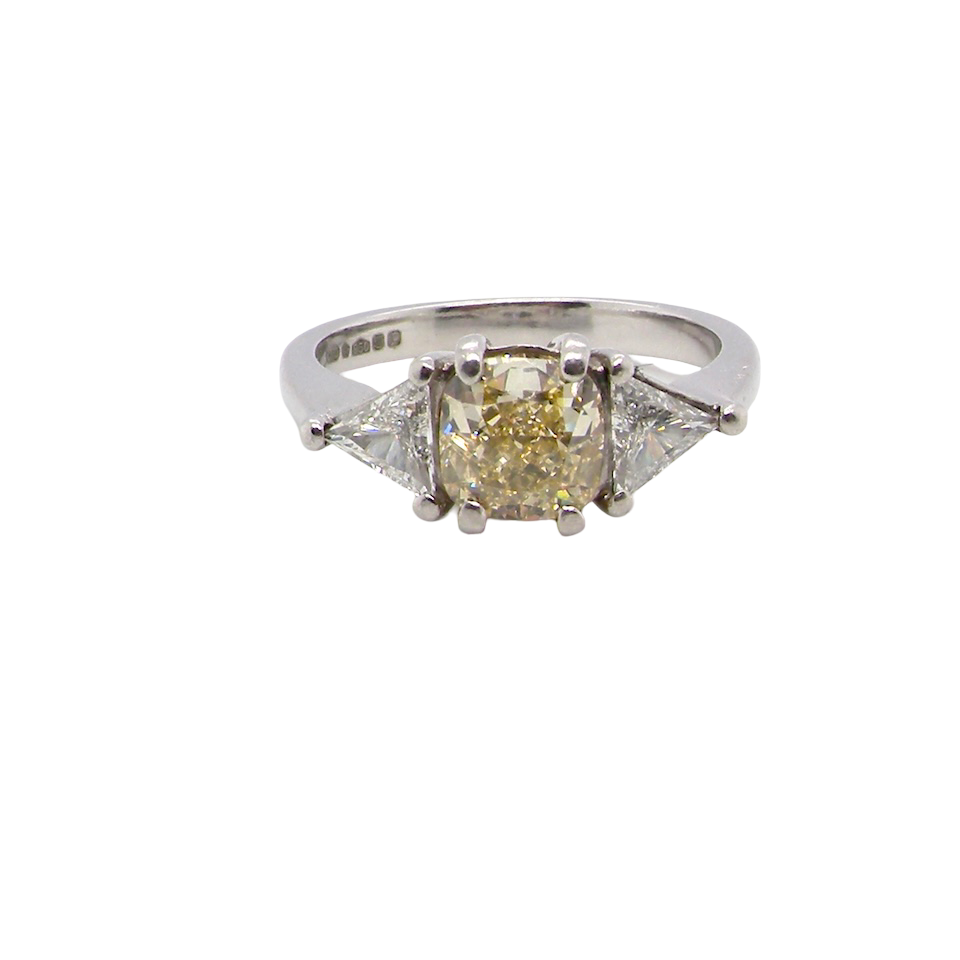 18-carat white gold, set with a vibrant fancy yellow cushion-cut diamond