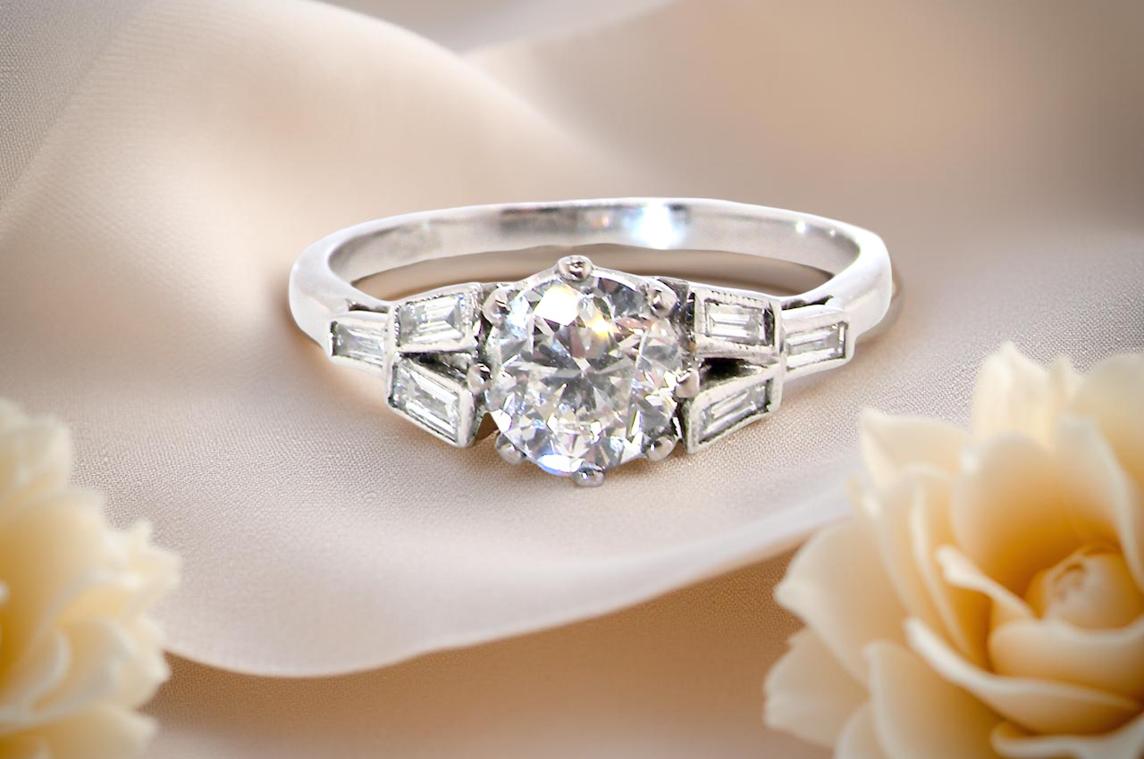 feature A beautifully proportioned Art Deco solitaire ring showcasing a sparkling old brilliant cut white diamond