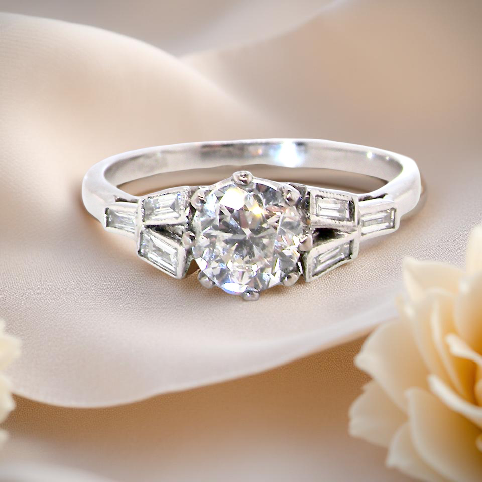 feature A beautifully proportioned Art Deco solitaire ring showcasing a sparkling old brilliant cut white diamond