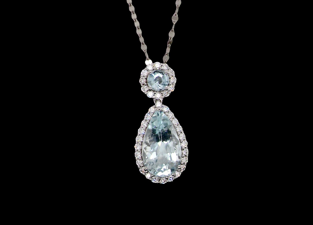Teardrop-shaped gemstone necklace on a black background