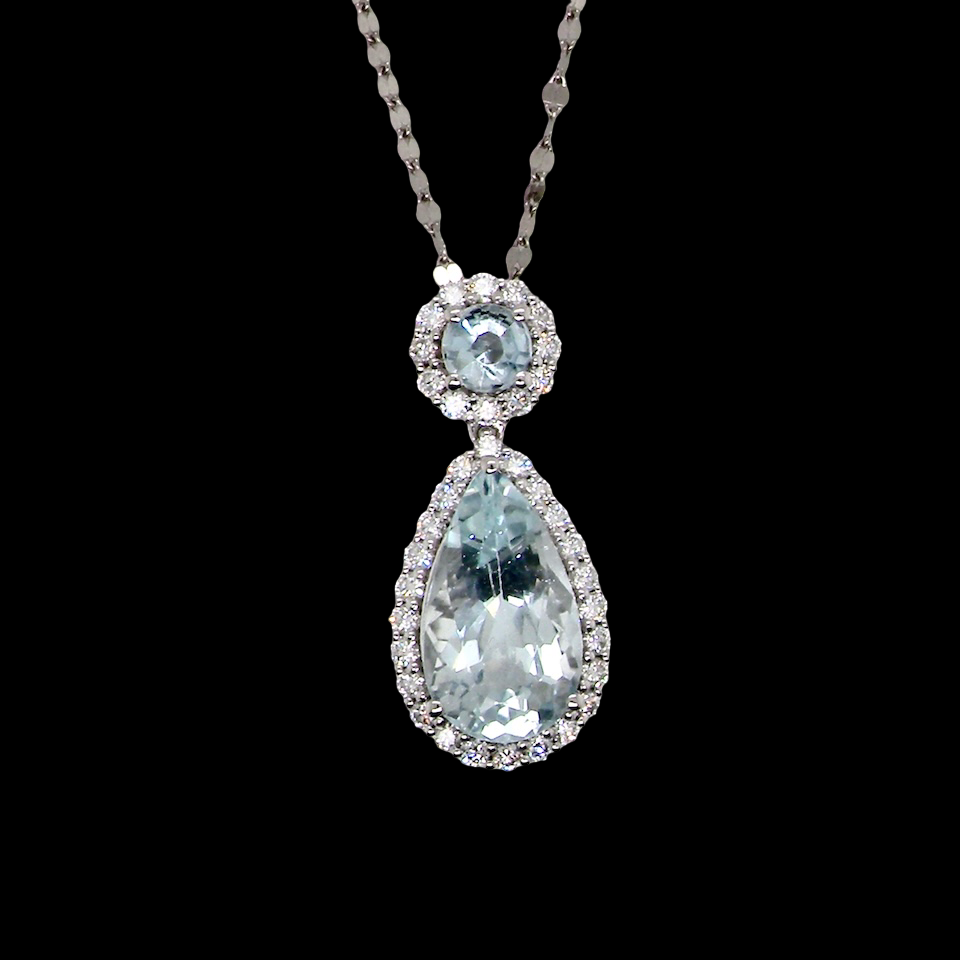 Teardrop-shaped gemstone necklace on a black background
