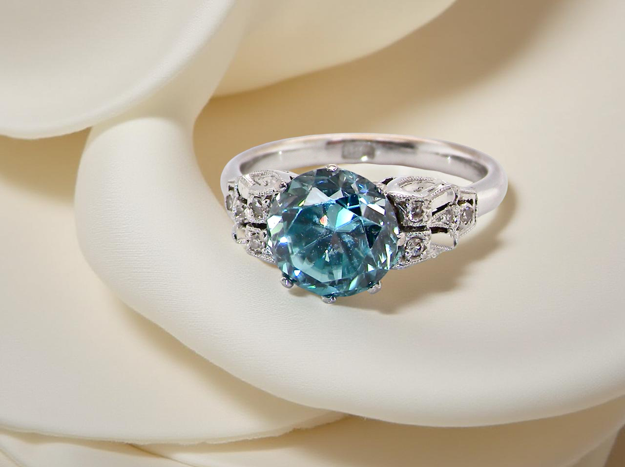 fine Art Deco ring that features a natural blue zircon centre stone