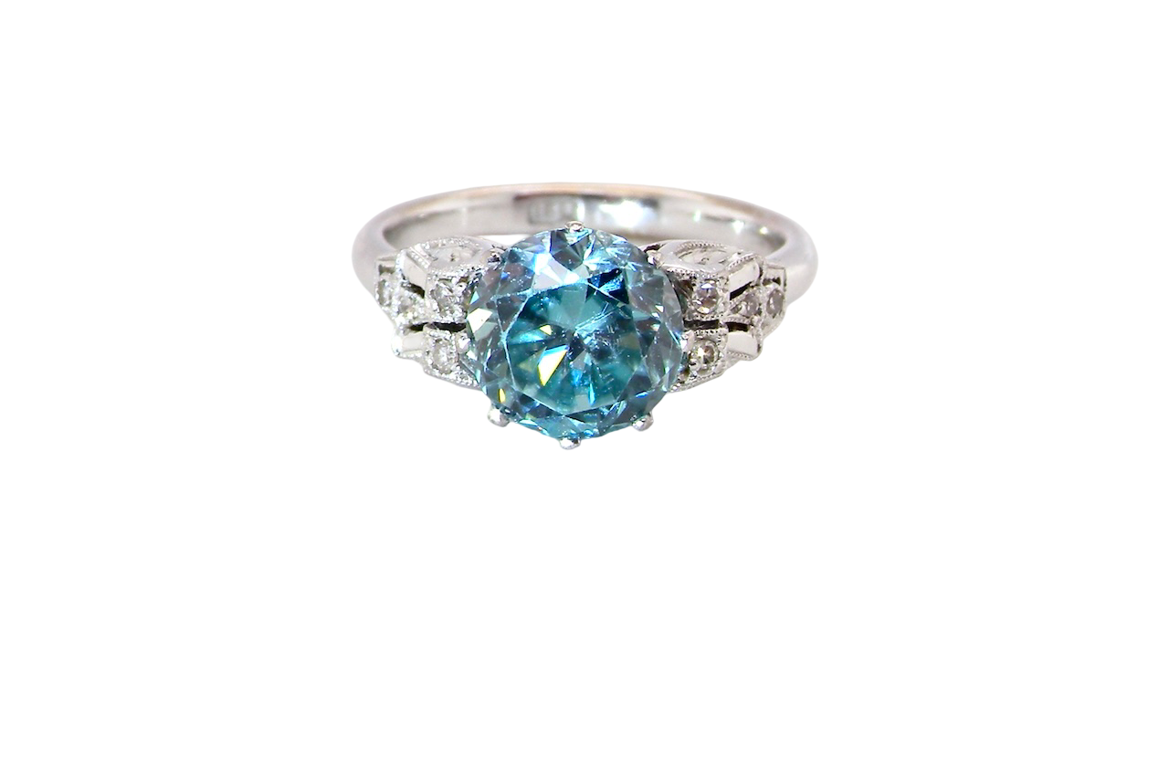 fine Art Deco ring that features a stunning natural blue zircon centre stone