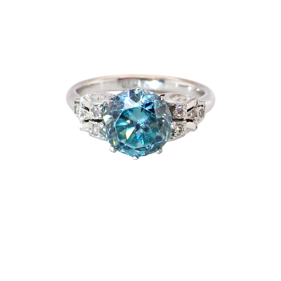 fine Art Deco ring that features a stunning natural blue zircon centre stone