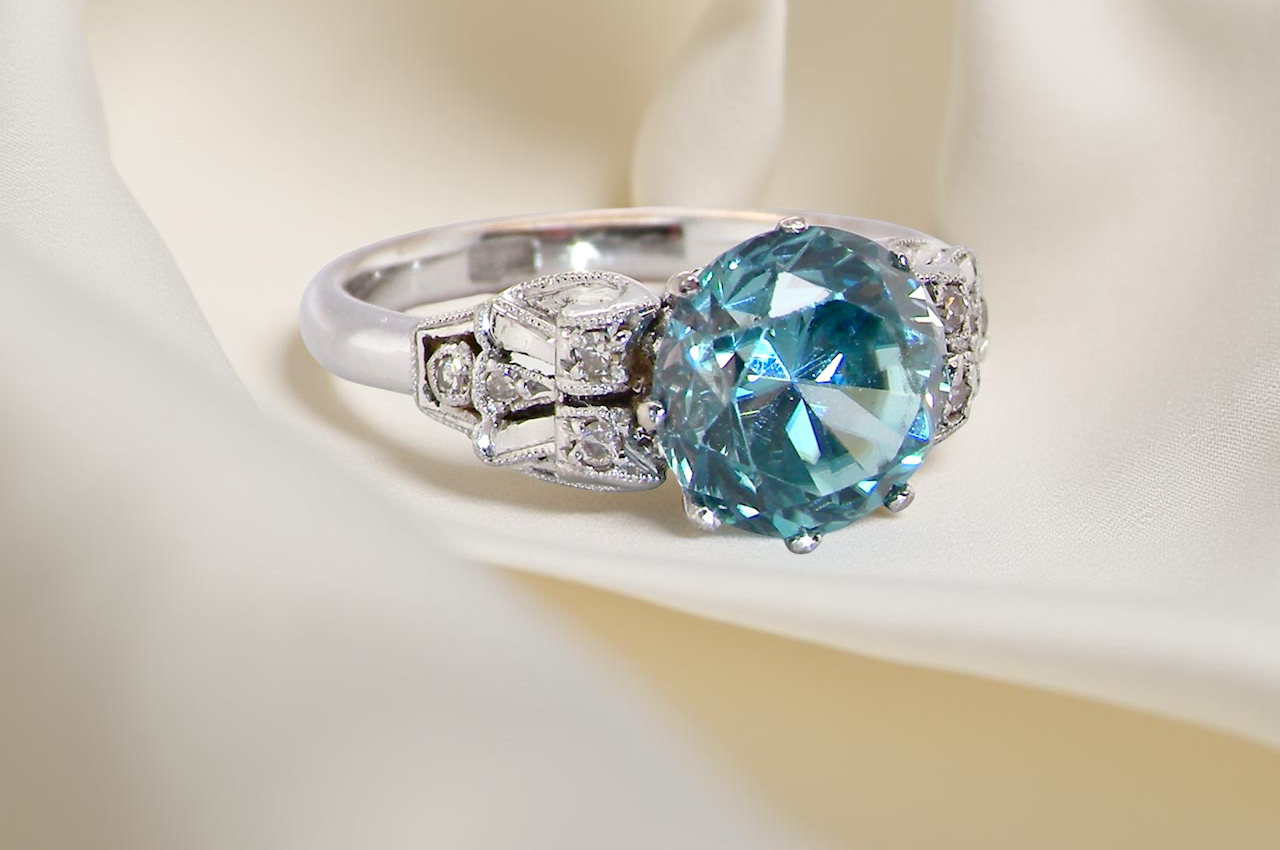 fine Art Deco ring that features a stunning natural blue zircon centre stone side