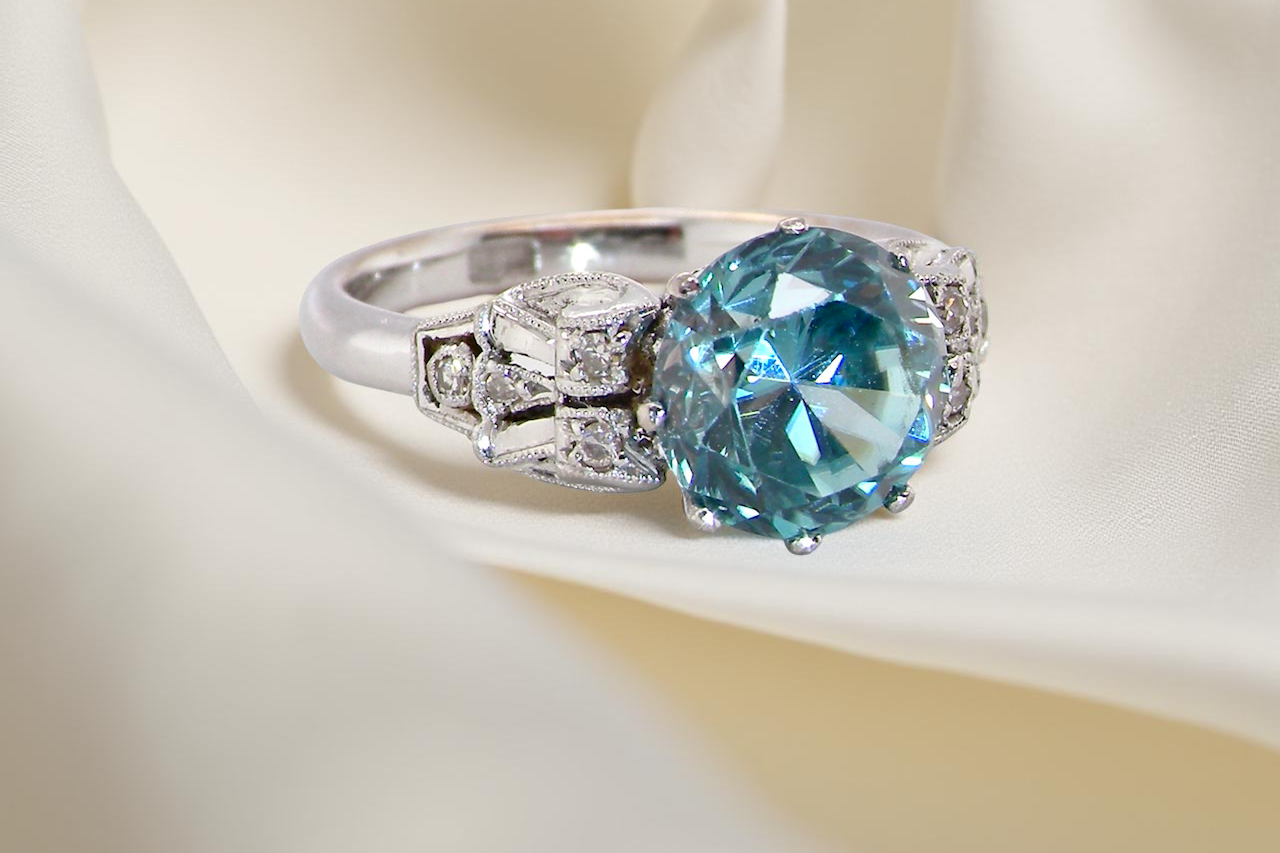 fine Art Deco ring that features a stunning natural blue zircon centre stone side