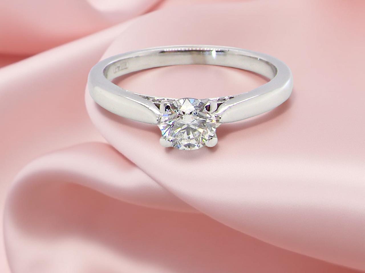 fine beautifully crafted solitaire ring featuring a brilliant-cut white diamond