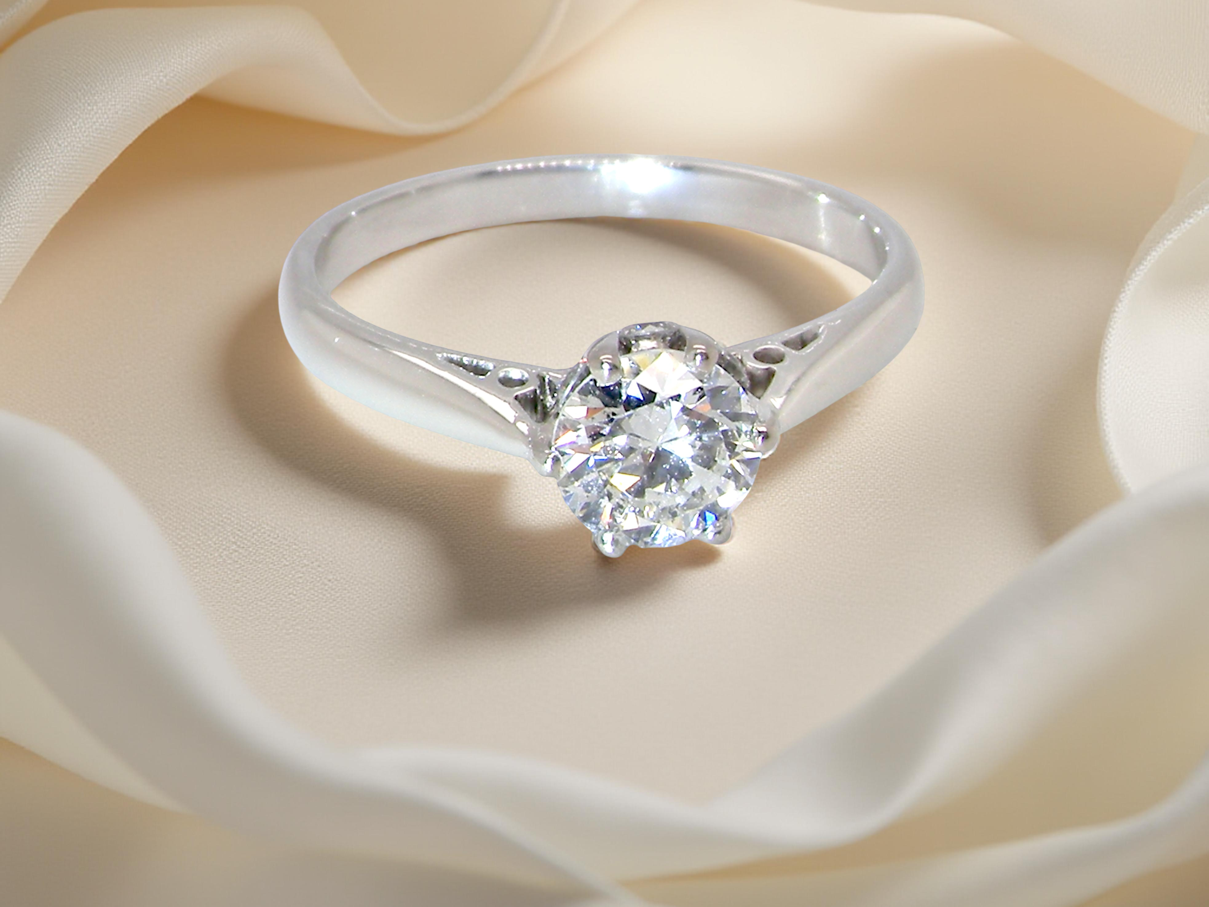 fine solitaire ring featuring a single brilliant-cut white diamond, measuring approximately 6mm (0.75 carats).
