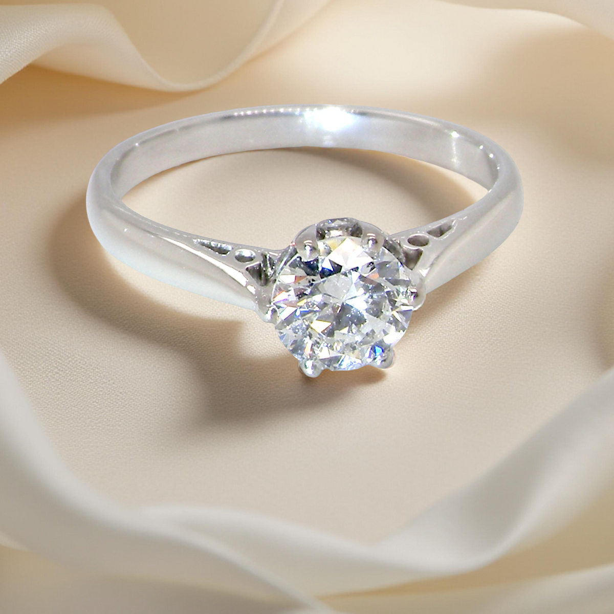 fine solitaire ring featuring a single brilliant-cut white diamond, measuring approximately 6mm (0.75 carats).