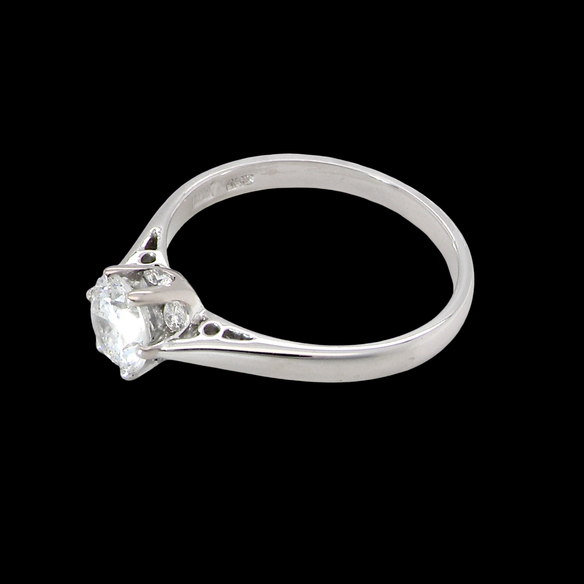 fine solitaire ring featuring a single brilliant-cut white diamond, measuring approximately 6mm (estimated 0.75 carats). side