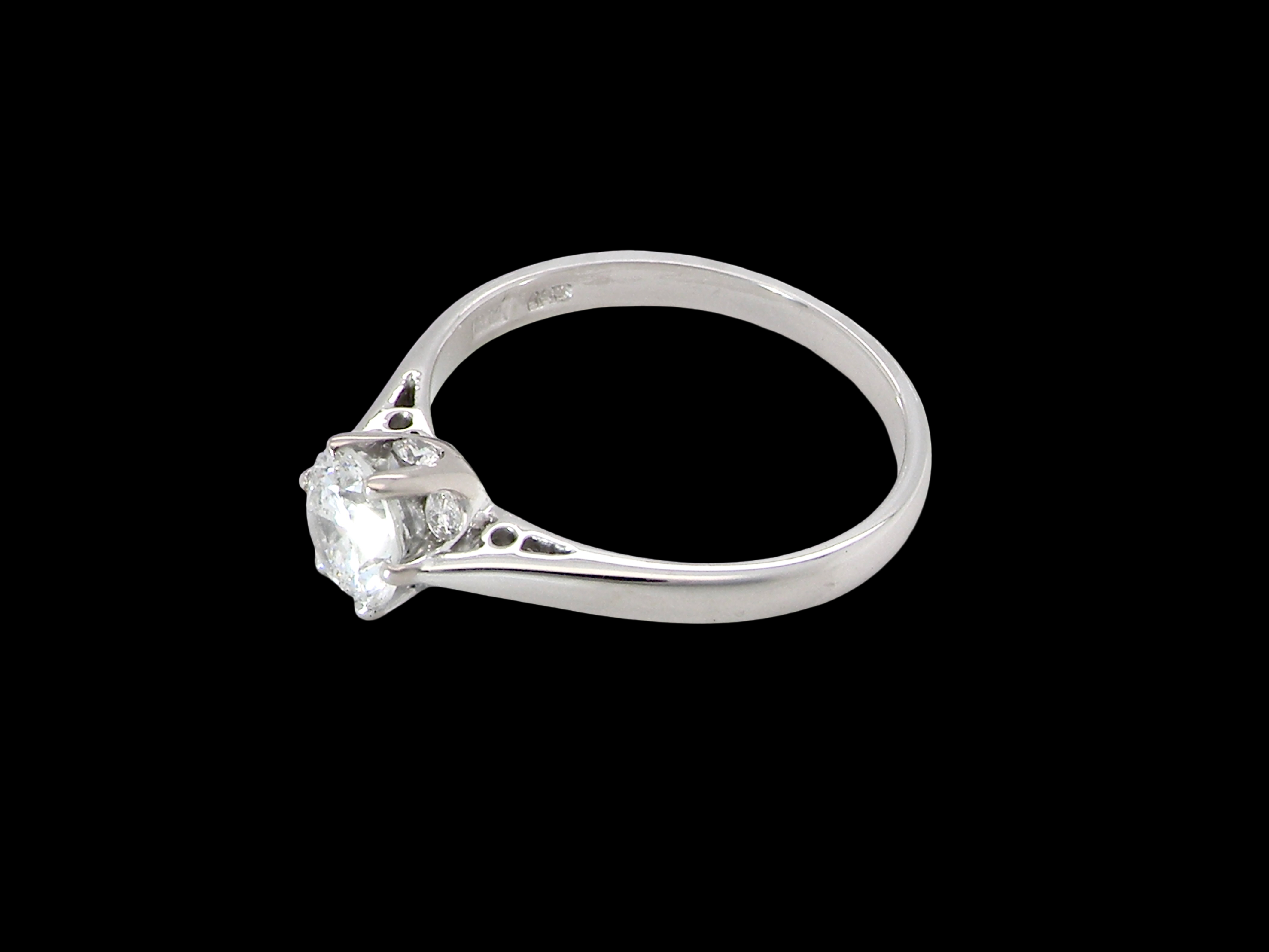 fine solitaire ring featuring a single brilliant-cut white diamond, measuring approximately 6mm (estimated 0.75 carats). side