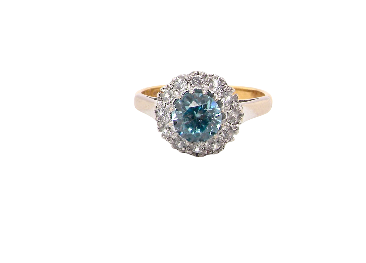 fine vintage cluster ring. The centre stone a natural blue zircon, 7mm diameter, bright sparkling refraction to the sky blue hue. 