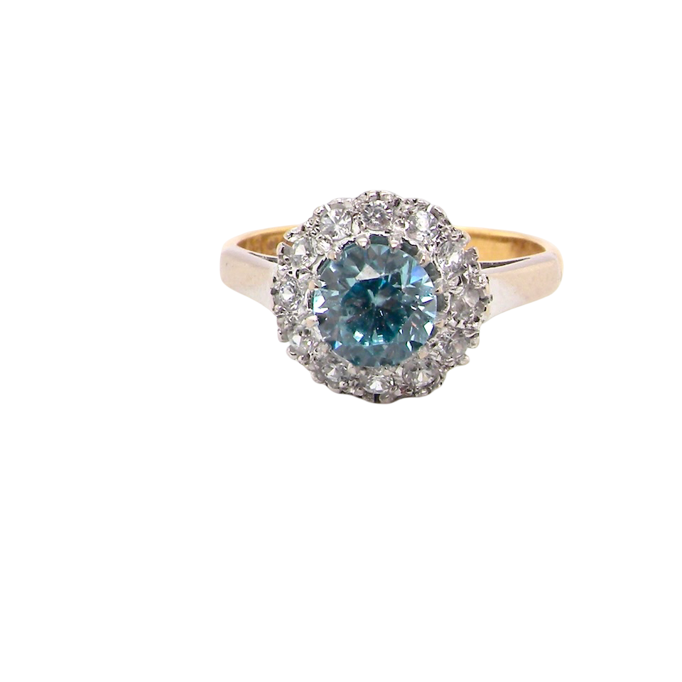fine vintage cluster ring. The centre stone a natural blue zircon, 7mm diameter, bright sparkling refraction to the sky blue hue. 