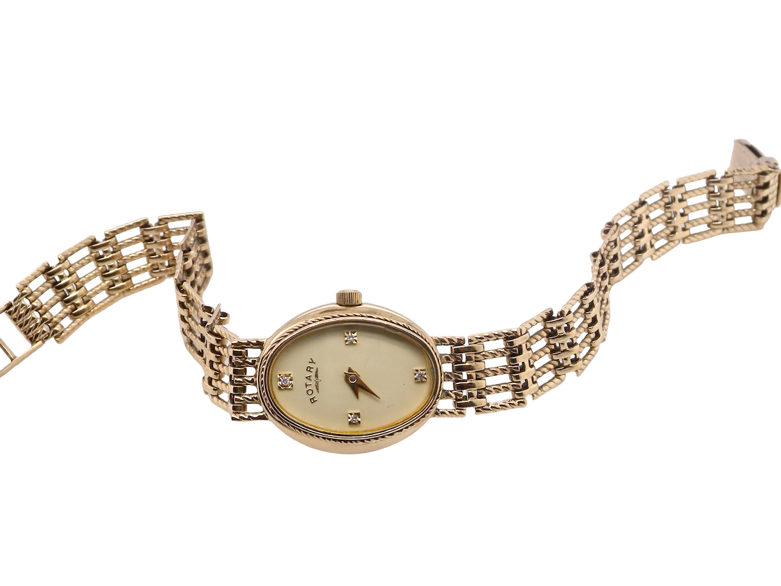 full view A 9 carat gold wrist watch by Rotary. Oval dial with a diamond dot at the 12. Champagne coloured dial.