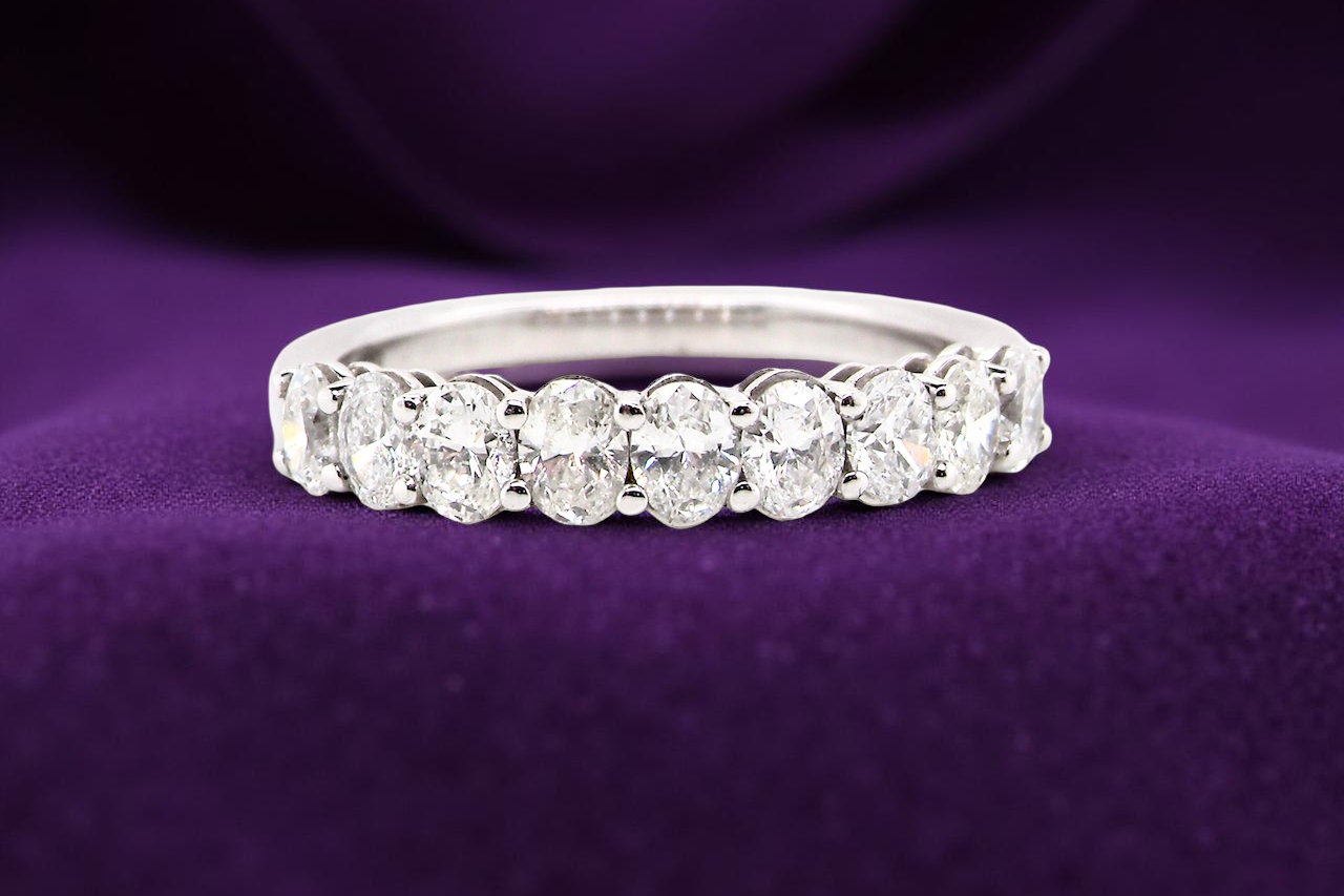 gorgeous half-hoop eternity ring set with 9 oval brilliant-cut white diamonds.