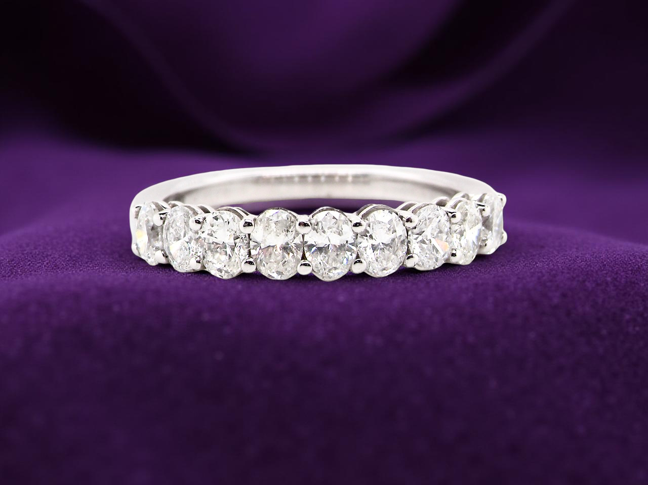 gorgeous half-hoop eternity ring set with 9 oval brilliant-cut white diamonds.