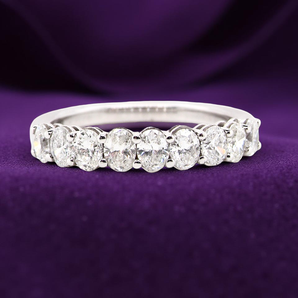 gorgeous half-hoop eternity ring set with 9 oval brilliant-cut white diamonds.