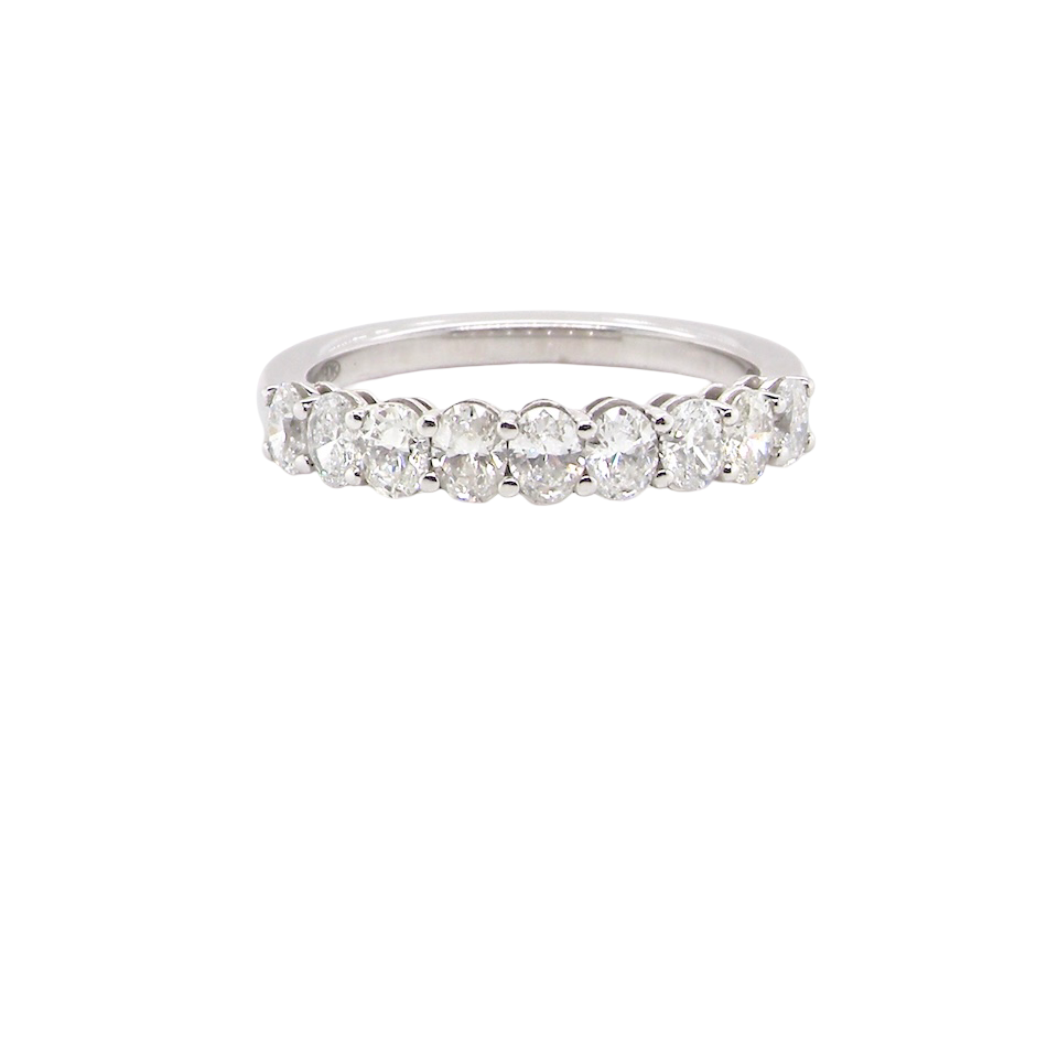 gorgeous half-hoop eternity ring set with nine oval brilliant-cut white diamonds.