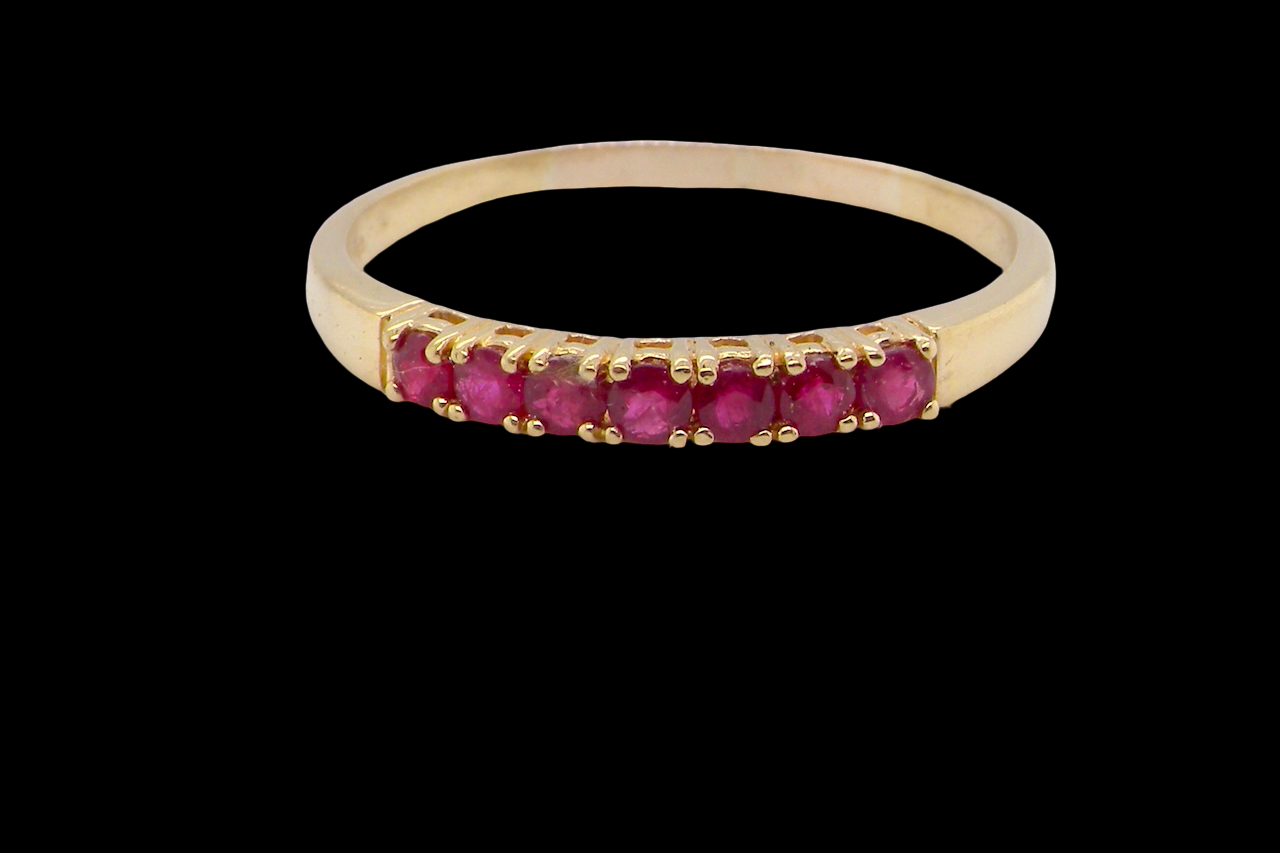 A half hoop ruby eternity ring
