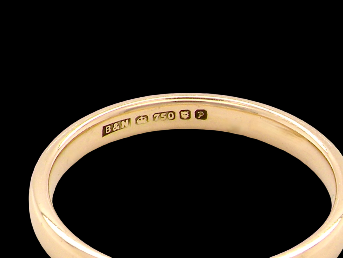 An 18 carat Gold Wedding Ring 