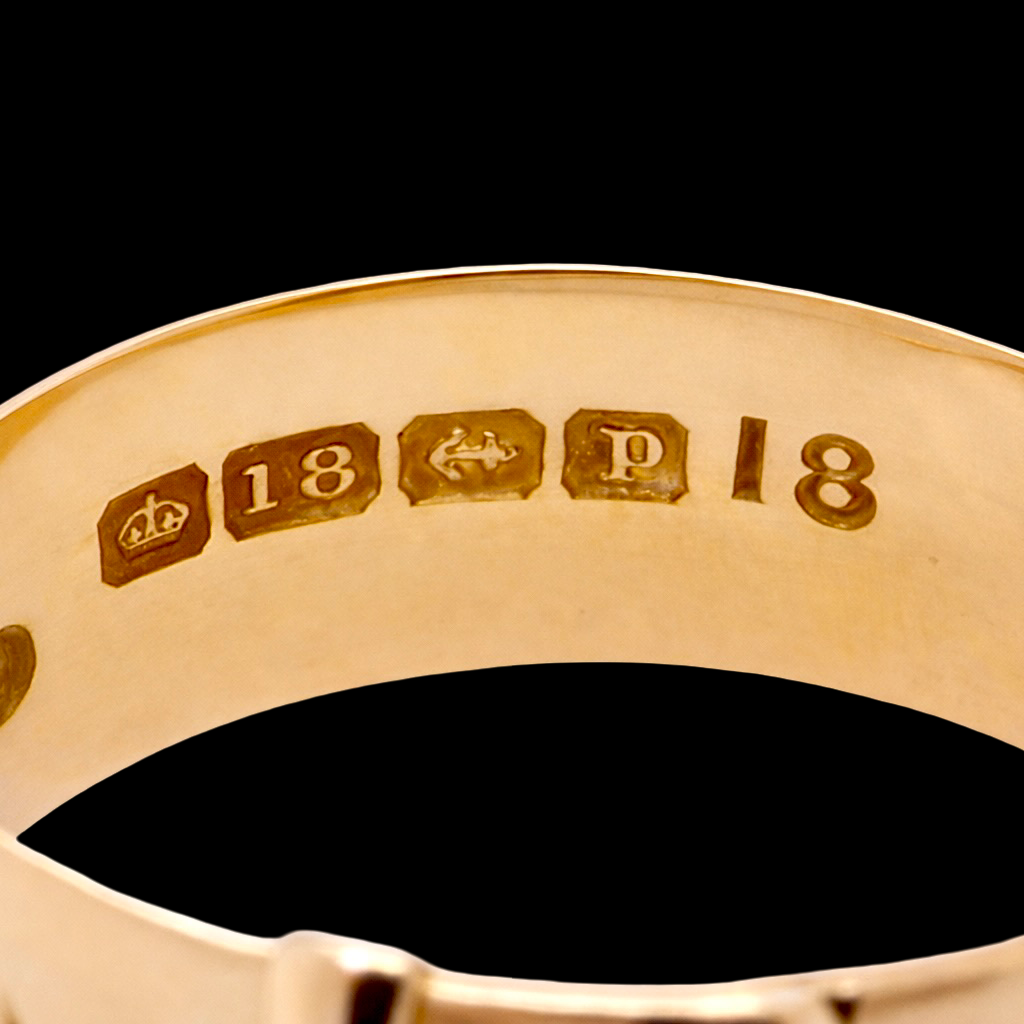 hallmarks A fine 18 carat gold buckle ring set with small old rose cut diamonds