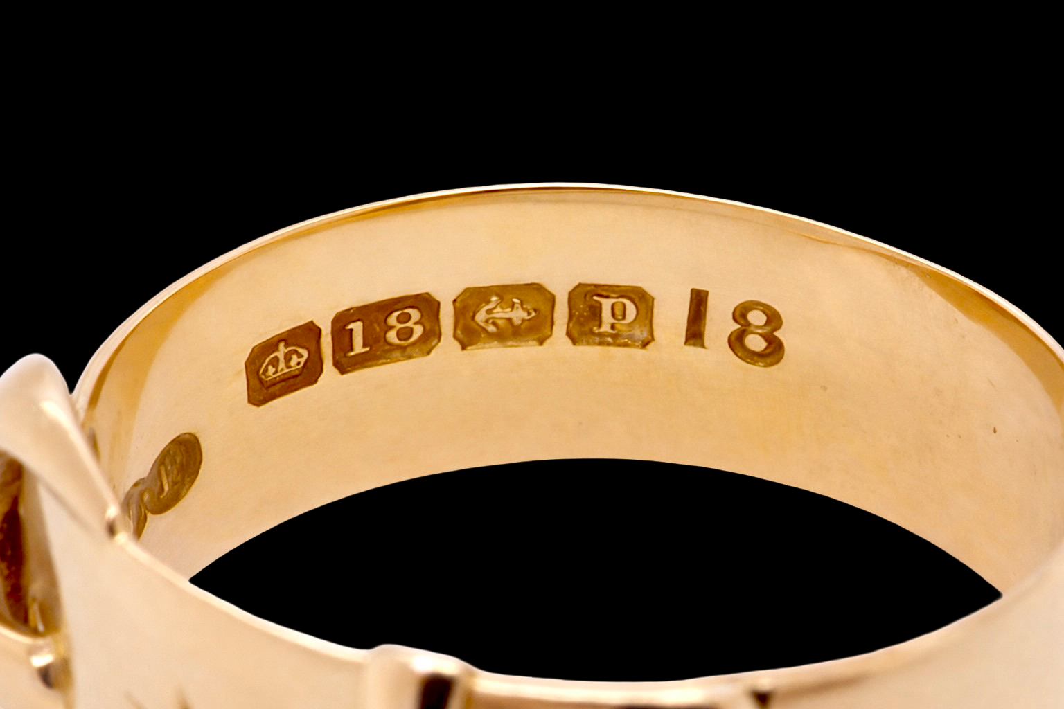 hallmarks A fine 18 carat gold buckle ring set with small old rose cut diamonds