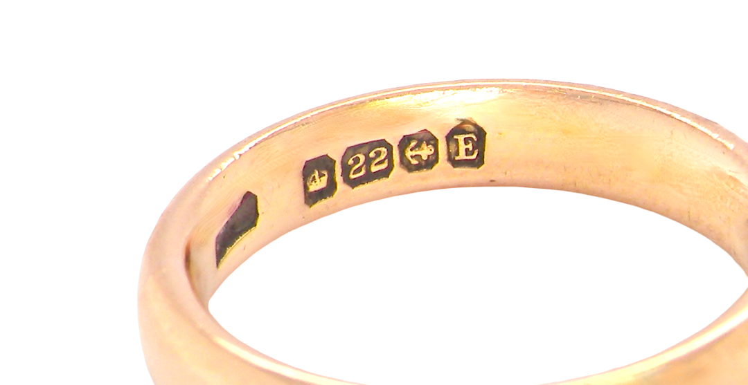 hallmarks wedding ring is 22 carat gold, just 2 points off pure.
3.6mm width, 1.9mm depth, weight 5.2grams. A lovely deep gold colour and patina.