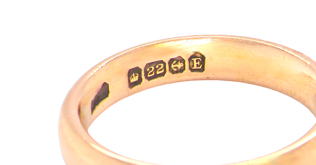 hallmarks wedding ring is 22 carat gold, just 2 points off pure.
3.6mm width, 1.9mm depth, weight 5.2grams. A lovely deep gold colour and patina.