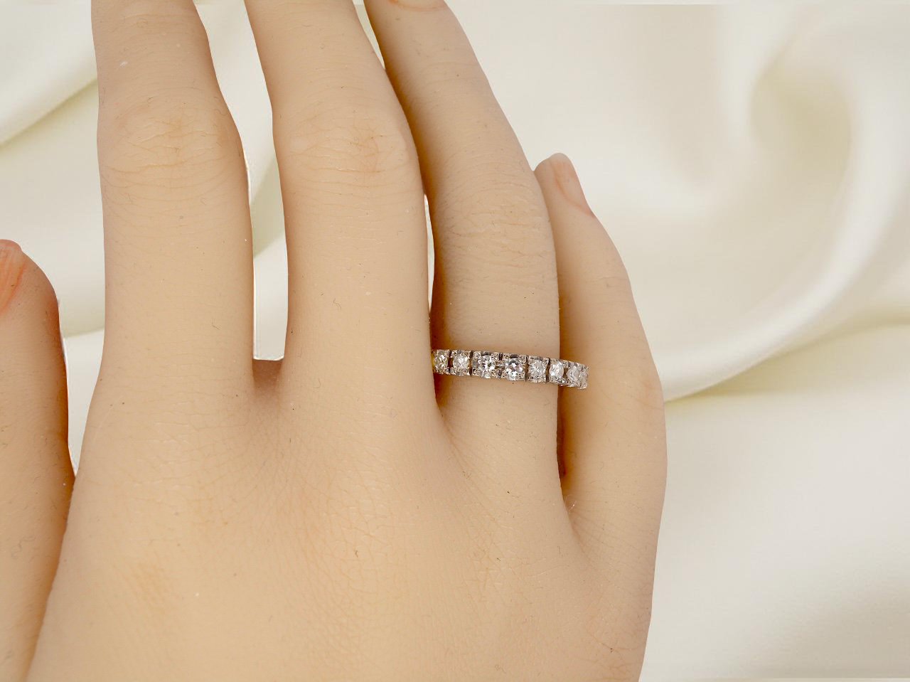 hand 1970s vintage half-hoop eternity ring, tested as 18 carat gold and elegantly set with nine brilliant-cut white diamonds.