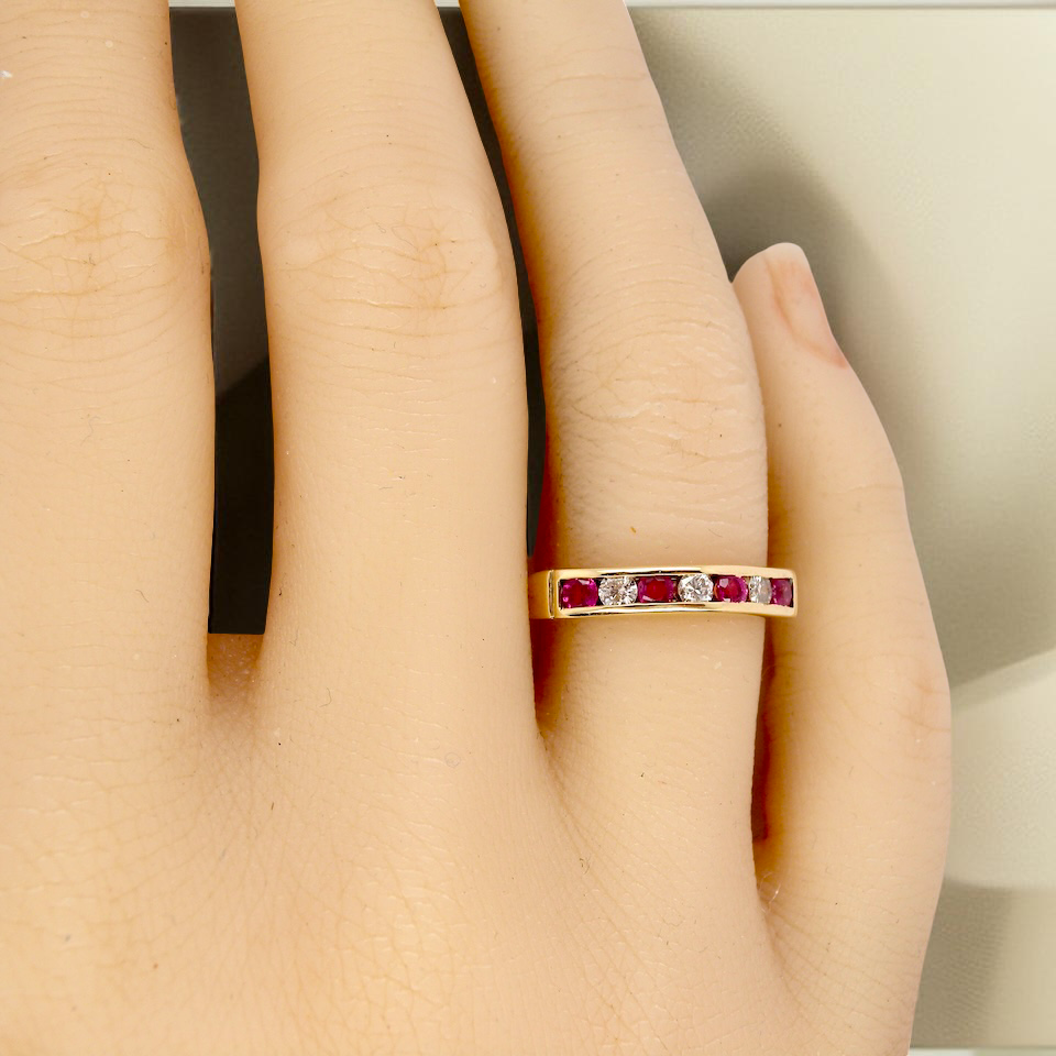 A 9 carat Yellow Gold Ruby & Diamond Eternity Ring