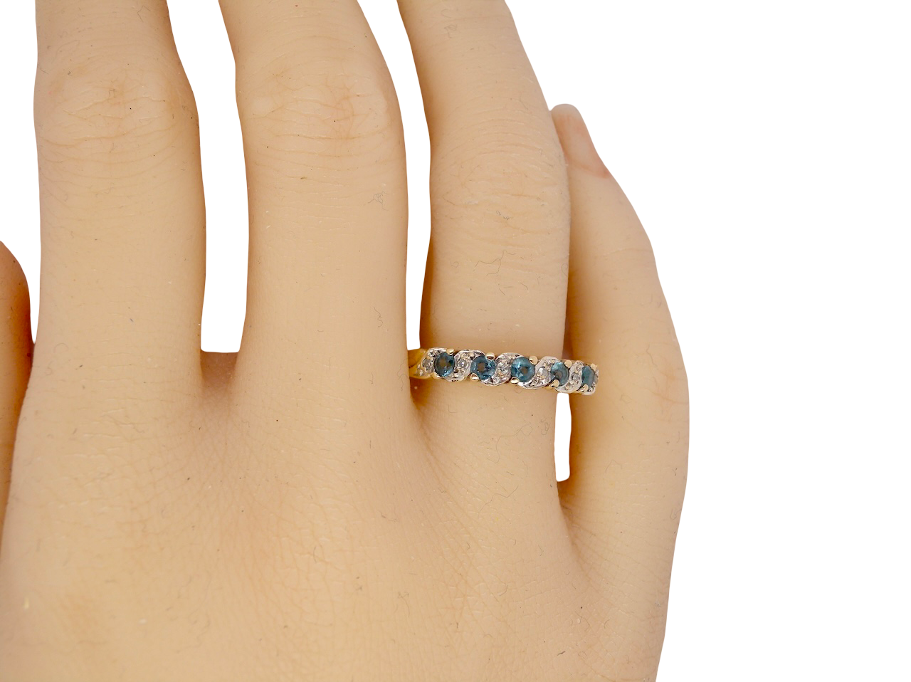 hand A 9 carat gold half hoop eternity ring. Set with five blue topaz gem stones, each 2.8mm. 