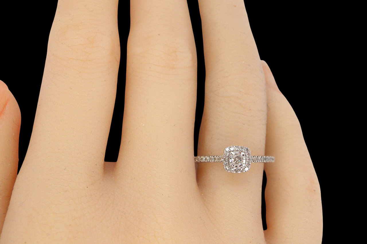 hand A 9 carat white gold Diamond halo ring