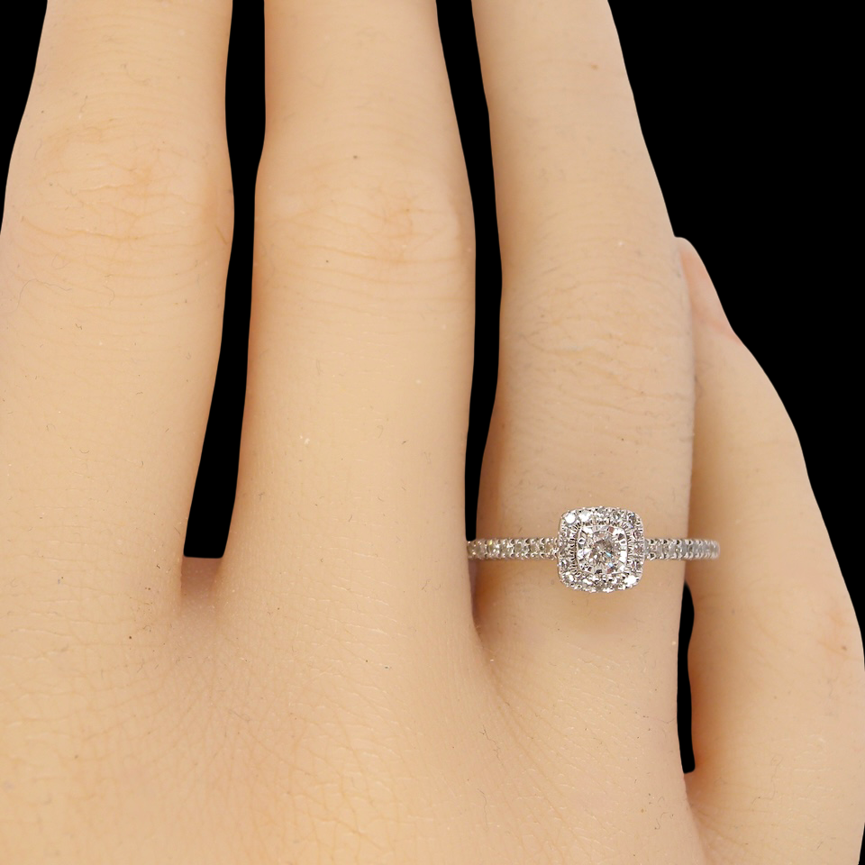 hand A 9 carat white gold Diamond halo ring