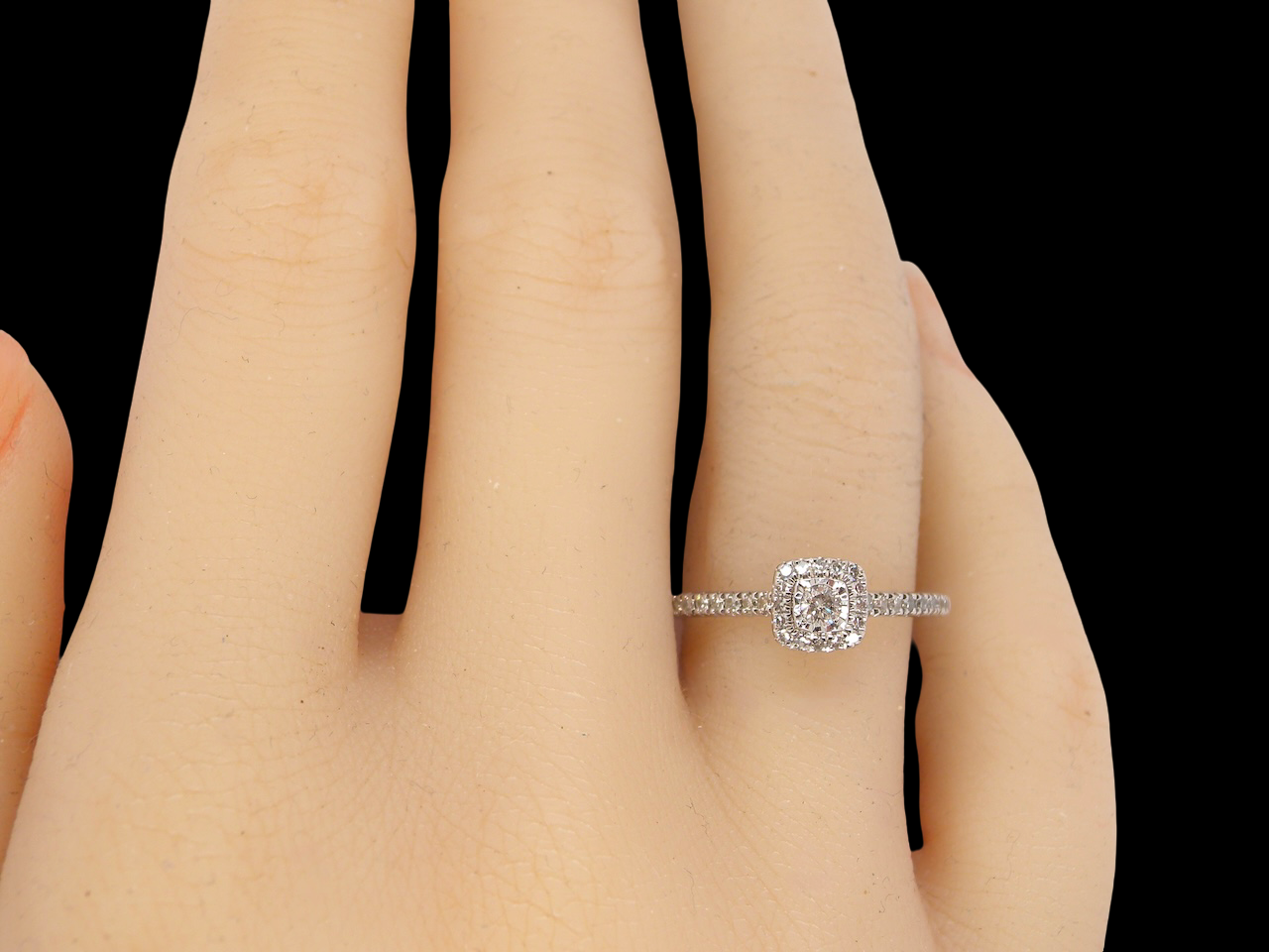 hand A 9 carat white gold Diamond halo ring