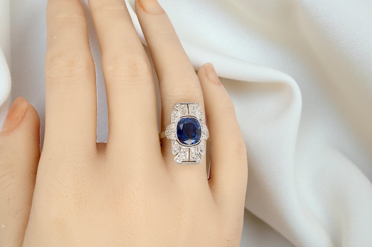 A Fabulous Art Deco Sapphire and Diamond Plaque Ring on a Hand