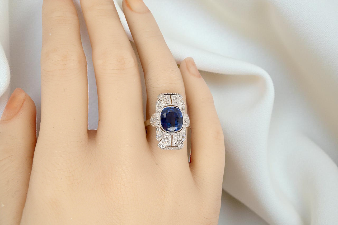 A Fabulous Art Deco Sapphire and Diamond Plaque Ring on a Hand
