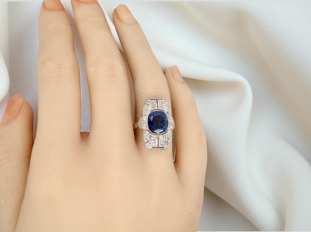 A Fabulous Art Deco Sapphire and Diamond Plaque Ring on a Hand