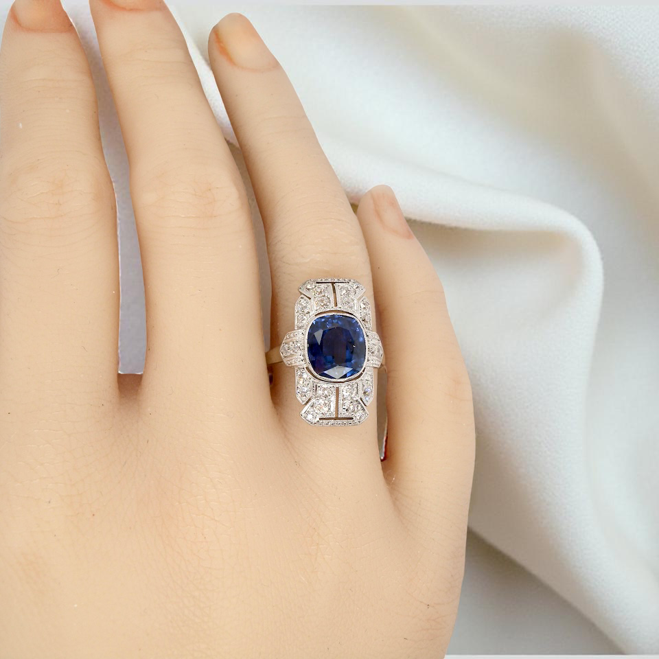 A Fabulous Art Deco Sapphire and Diamond Plaque Ring on a Hand