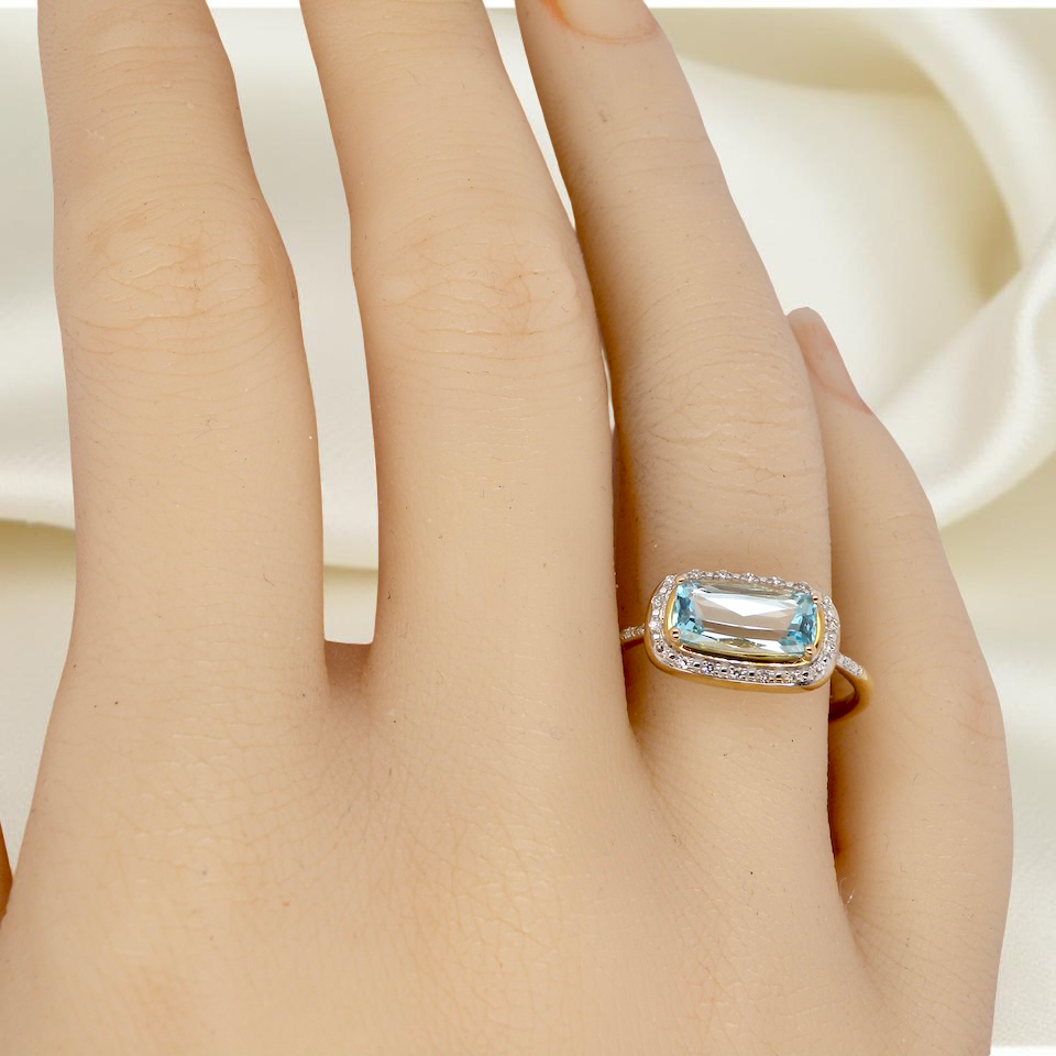 A Modern Vintage Style Blue Topaz & Diamond Cluster Ring