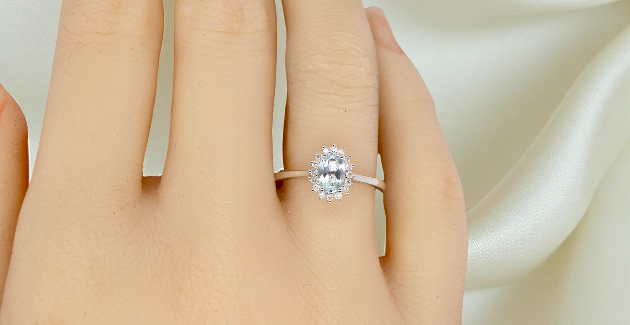 A NEW blue topaz and diamond ring