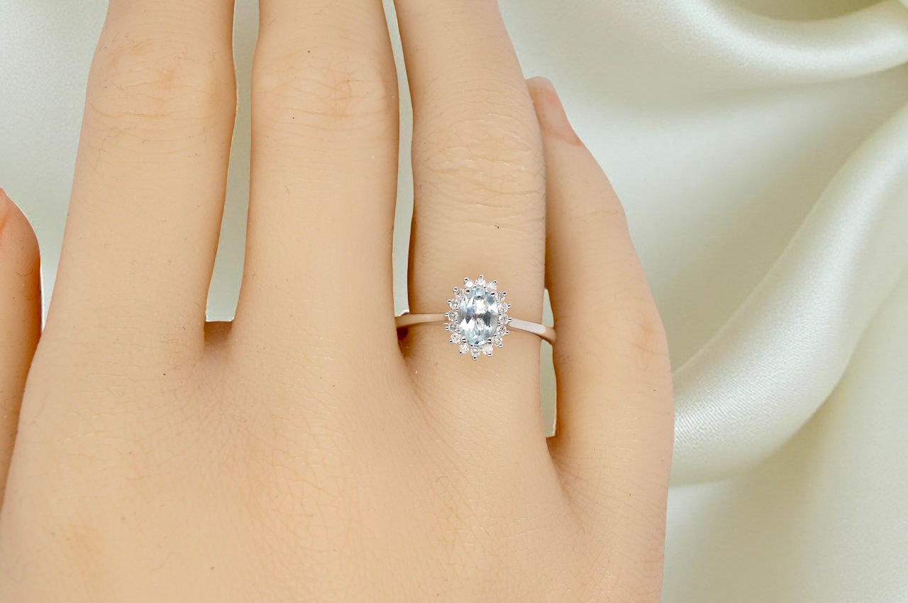A NEW blue topaz and diamond ring