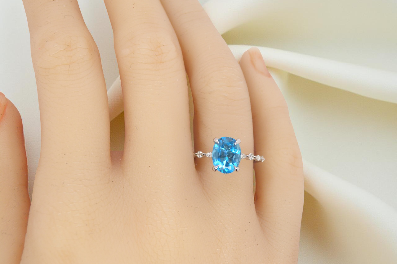 hand A NEW ring- but with a gemstone that we have taken from an old ring that was worn out, so its a new lease of life! The topaz measures 9x7mm.