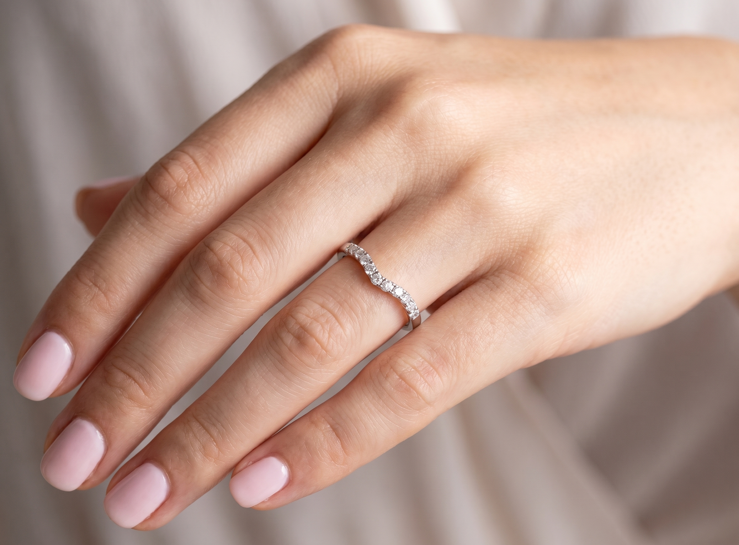 hand A Platinum half hoop ring featuring a gently contoured U-shaped centre, designed to allow a cluster or solitaire ring to sit comfortably alongside.
