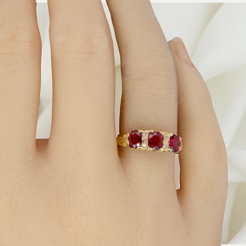 A Victorian Style 18 carat Gold Ruby & Diamond Boat Ring (London 1978)