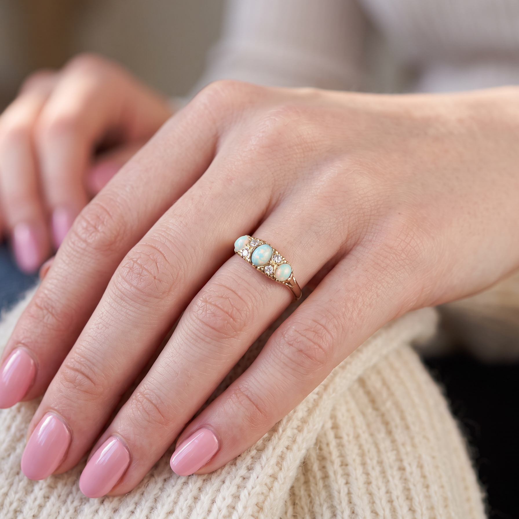 hand A Victorian style opal and diamond ring